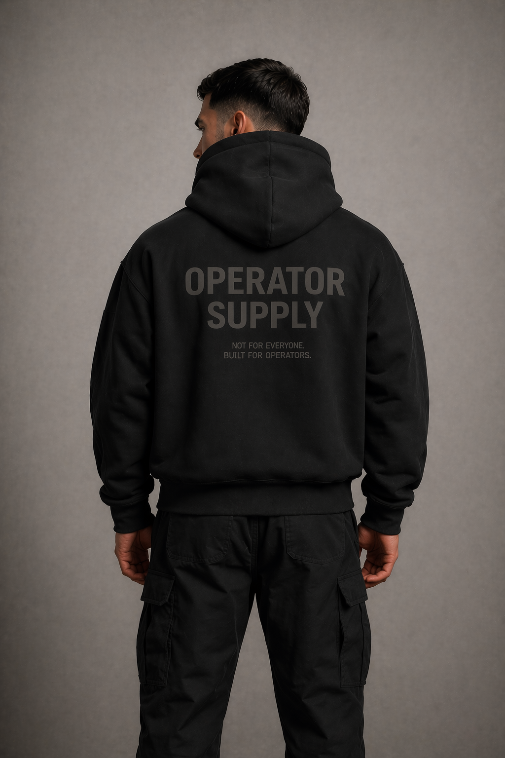black heavyweight hoodie operator supply back print worn by model rear view